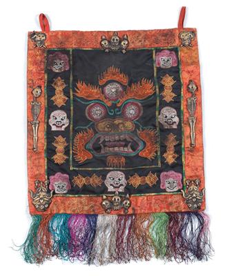 Kingdom of Mustang, Nepal: a dance apron for ‘Cham’ dances, embroidered with the face of the great tutelary god ‘Mahakala’, as well as with 8 sacred bronzes sewn on. - Tribal Art