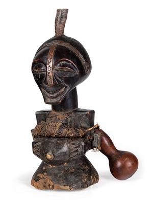 Songye, Dem. Rep. of Congo: a male ‘Nkisi’ power figure, with antelope horns, metal fitting, and much ‘magic material’. Style: Belande. - Tribal Art