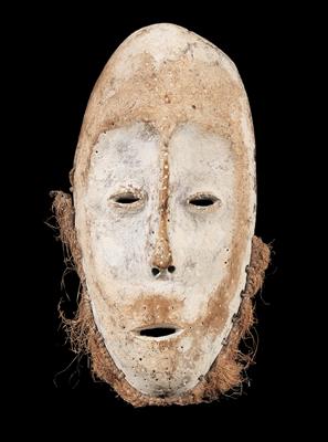 Lega (also Warega or Rega), Dem. Rep. of Congo: a face mask in the ‘idimu’ style, with white kaolin coating and a beard made of fibres. - Tribal Art