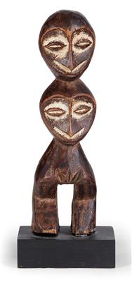 Lega (also Warega or Rega), Dem. Rep. of Congo: a female figure made of wood, with two heads on top of each other. Probably an object used as a ‘hunting amulet’. Rare. - Tribal Art