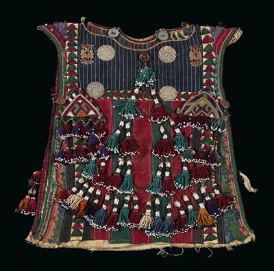 Tekke Turkmens, Turkmenistan, Iran, Afghanistan: a child’s dress, blue, red and green. With two typical Tekke appliqués made of gilt silver and red glass stones with round discs, two triangular amulets and many colourful tassels. - Tribal Art