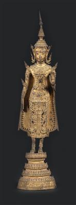 Thailand: a Buddha figurine in lavish courtly robes made of bronze, gilded, and standing on a four-tiered base. Style: Rattanakosin, 19th century. - Tribal Art