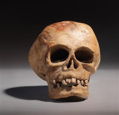 A carved wood skull, - Tribal Art