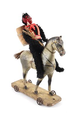 Krampus Candy-Container Aufstellfigur mit Holzpferd, auf Rädern, um 1920, - Toys