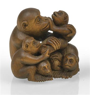 A wood netsuke of a monkey with four young monkies - Asian art