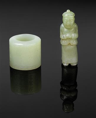 An archer’s ring and a figure of a Chinese man - Asian art