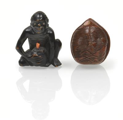 Two wooden netsukes of a kuronbojin (coral diver) and a nut - Asian art