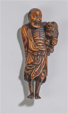 A Netsuke of a Sennin with Shishi, Japan, 18th/19th Century, - Asian Art