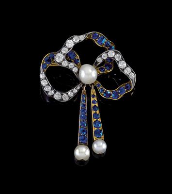 A diamond and sapphire brooch in the shape of a bow - Jewellery